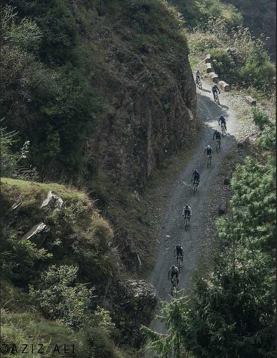 group of riders in the himalayan mountains