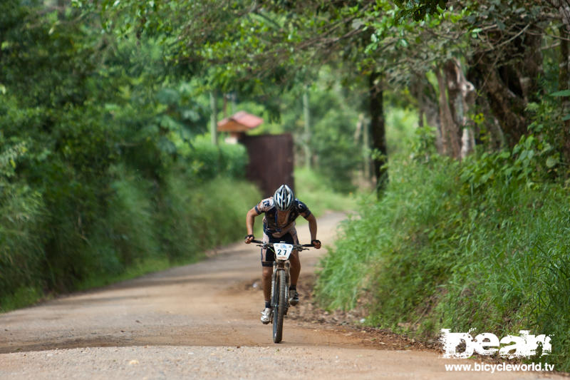 Travis Hauck has to get out of the saddle to stretch his legs on the climb