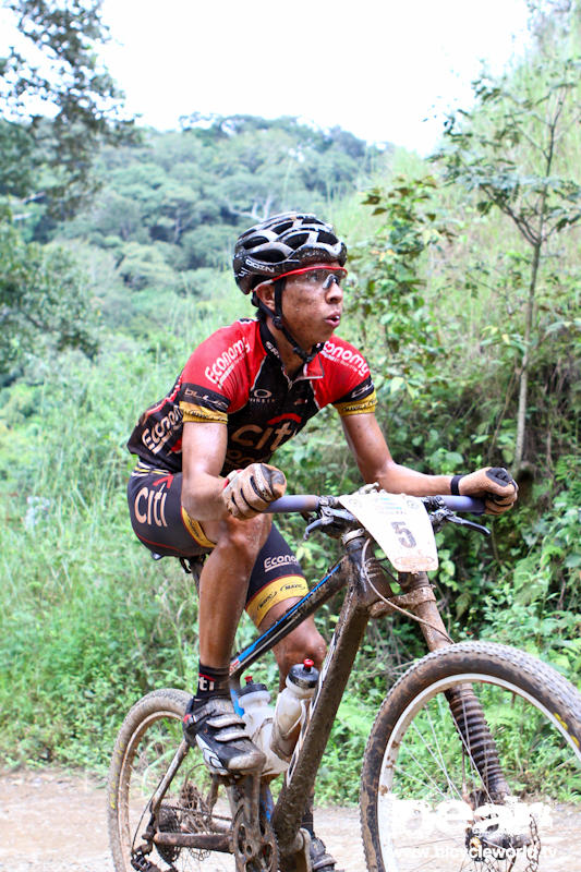 eyeing the climb ahead, this la ruta participant suffers.
