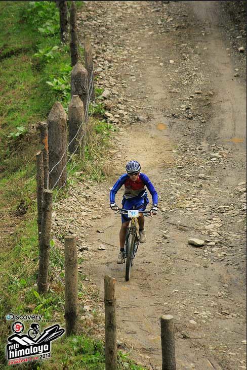 ripping down a fire road on the Himalaya's MTB